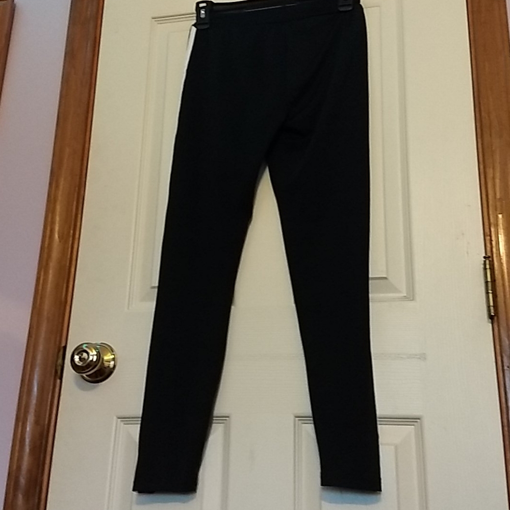 Black leggings with white and red accent stripe